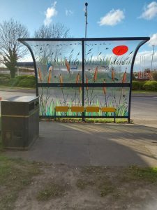 Bus shelter after refurbishment with artwork glazing