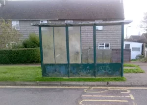 Green bus shelter before refurbishment